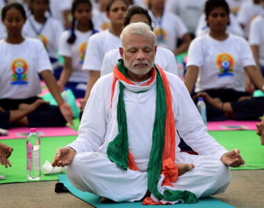 Prime Minister Narendra Modi (front) performs yoga along with thousands of others at a mass yoga session to mark the International Day of Yoga 2015 at Rajpath in New Delhi, June 21. (Manvender Vashist | PTI) page-yoga-day-02