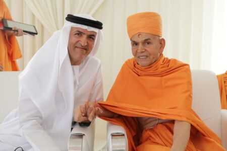 Mahant Swami Maharaj and Dr Mugheer Khamis Al Khaili. Chairman of the Department of Community Development and member of the Executive Council exchange greetings page-uae-baps-hindu-temple-05