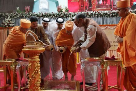 Mahant Swami Maharaj, senior sadhus and distinguished guestspour holy waters into the foundation page-uae-baps-hindu-temple-07