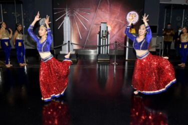NEW YORK, NEW YORK - NOVEMBER 04: Dancers perform in celebration of Diwali at The Empire State Building on November 04, 2021 in New York City. (Photo by Noam Galai/Getty Images for Empire State Realty Trust)