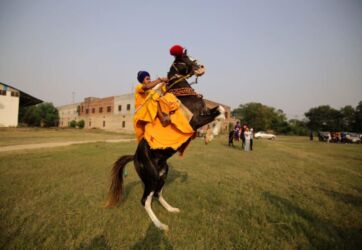 Nihang Sikhs show their skills during Fateh Diwas, a religious procession taken out to mark the Bandi Chorh Diwas in Amritsar. (APHIMAGES)
