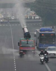 An anti-smog gun sprinkles atomized water in the air to curb air pollution as the city is engulfed in heavy smog in New Delhi, India, 06 November 2021